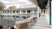 a porch with chairs and a railing at Leland Hotel Palo Alto in Palo Alto