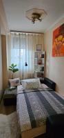 A bed or beds in a room at ANNA GYÖNGYE APARTMAN DEBRECEN