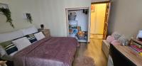 A bed or beds in a room at ANNA GYÖNGYE APARTMAN DEBRECEN