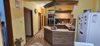 A kitchen or kitchenette at ANNA GYÖNGYE APARTMAN DEBRECEN