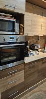A kitchen or kitchenette at ANNA GYÖNGYE APARTMAN DEBRECEN