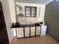 Kuchyň nebo kuchyňský kout v ubytování Sunrise Apartment Pamporovo