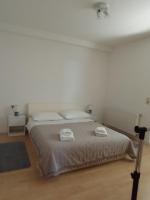 Łóżko lub łóżka w pokoju w obiekcie Apartman Carpe Diem