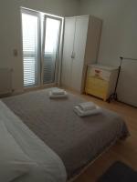 Łóżko lub łóżka w pokoju w obiekcie Apartman Carpe Diem