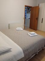 Łóżko lub łóżka w pokoju w obiekcie Apartman Carpe Diem