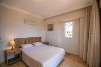 Postel nebo postele na pokoji v ubytování Villa Palm Tree