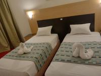 Postel nebo postele na pokoji v ubytování AraCan Pyramids Hotel By Versailles