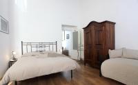 A bed or beds in a room at Napoli Pietrasanta LT