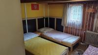 Postel nebo postele na pokoji v ubytování Trempská Chalupa Aronie