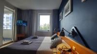 Posteľ alebo postele v izbe v ubytovaní Apartament Sympatia Kołobrzeg Etna Polonia 718