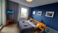 Televízia a/alebo spoločenská miestnosť v ubytovaní Apartament Sympatia Kołobrzeg Etna Polonia 718