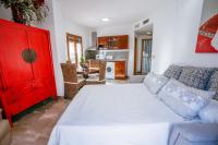 A bed or beds in a room at Apartamentos El Tranco del Mar