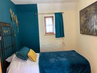Łóżko lub łóżka w pokoju w obiekcie Manoir du Charme dans les Gorges du Tarn LOZERE