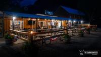 a restaurant with tables and chairs at night at Ouray Riverside Resort - Inn & Cabins in Ouray