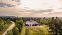 an aerial view of a house in the middle of a field at Fjällriket Baggården in Baggården