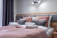Posteľ alebo postele v izbe v ubytovaní Trevilles Apartamenty - Green Hills