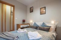 Posteľ alebo postele v izbe v ubytovaní Trevilles Apartamenty - Green Hills