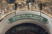 a sign on a brick wall saying thank you for visiting borough market at citizenM Southwark Bankside in London