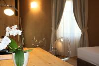 Posteľ alebo postele v izbe v ubytovaní Hotel Orso Grigio