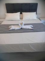 Postel nebo postele na pokoji v ubytování Fanadir Bay Resort & Aqua Escape