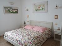 A bed or beds in a room at B&B Mimosa e Lillà