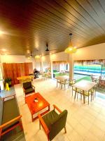 a large living room with tables and chairs at D'svarga Glamping in Seturan