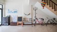 a living room with two bikes and a staircase at Fu Taitung Homestay in Taitung City