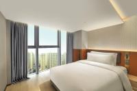 Echarm Plus Hotel - Xi'an Daminggong West Subway Stationにあるベッド