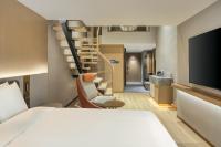 Echarm Plus Hotel - Xi'an Daminggong West Subway Stationにあるベッド