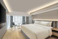 Echarm Plus Hotel - Xi'an Daminggong West Subway Stationにあるベッド