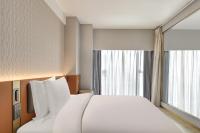 Echarm Plus Hotel - Xi'an Daminggong West Subway Stationにあるベッド