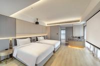 Echarm Plus Hotel - Xi'an Daminggong West Subway Stationにあるベッド