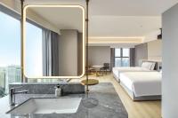 Echarm Plus Hotel - Xi'an Daminggong West Subway Stationにあるベッド