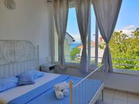 Łóżko lub łóżka w pokoju w obiekcie Apartments Savic