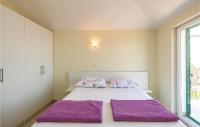 Postel nebo postele na pokoji v ubytování Holiday Home Gornji Tucepi 36