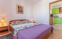 Postel nebo postele na pokoji v ubytování Apartment Makarska Put Zuke Vi