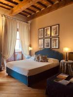 A bed or beds in a room at Capri Moon Guest House