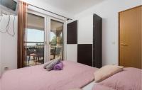 Posteľ alebo postele v izbe v ubytovaní Nice Apartment In Rovanjska - Jasenice