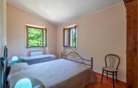 A bed or beds in a room at Valguerriera - Rosa Bianca