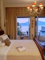 a bedroom with a bed with a view of the ocean at Casa da Sogno Elegant Studio in Nafpaktos