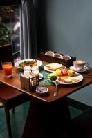 un tavolo di legno con piatti di cibo sopra di The Memory Danang Boutique a Da Nang