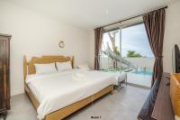 Postel nebo postele na pokoji v ubytování Venice Beach Village Hua Hin Pool Villa