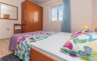 Postel nebo postele na pokoji v ubytování Apartment Makarska Put Zuke Vi