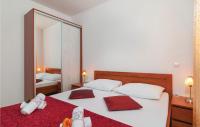 Postel nebo postele na pokoji v ubytování Apartment Supetar 43