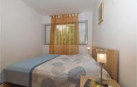 Posteľ alebo postele v izbe v ubytovaní Apartment Prigradica 55