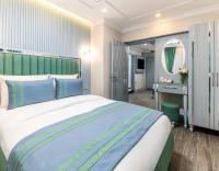 Postel nebo postele na pokoji v ubytování Santa Rio Gold Taxim Hotel