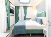 Postel nebo postele na pokoji v ubytování Santa Rio Gold Taxim Hotel