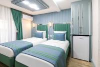 Postel nebo postele na pokoji v ubytování Santa Rio Gold Taxim Hotel