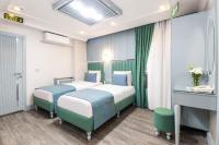 Postel nebo postele na pokoji v ubytování Santa Rio Gold Taxim Hotel