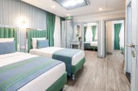 Postel nebo postele na pokoji v ubytování Santa Rio Gold Taxim Hotel